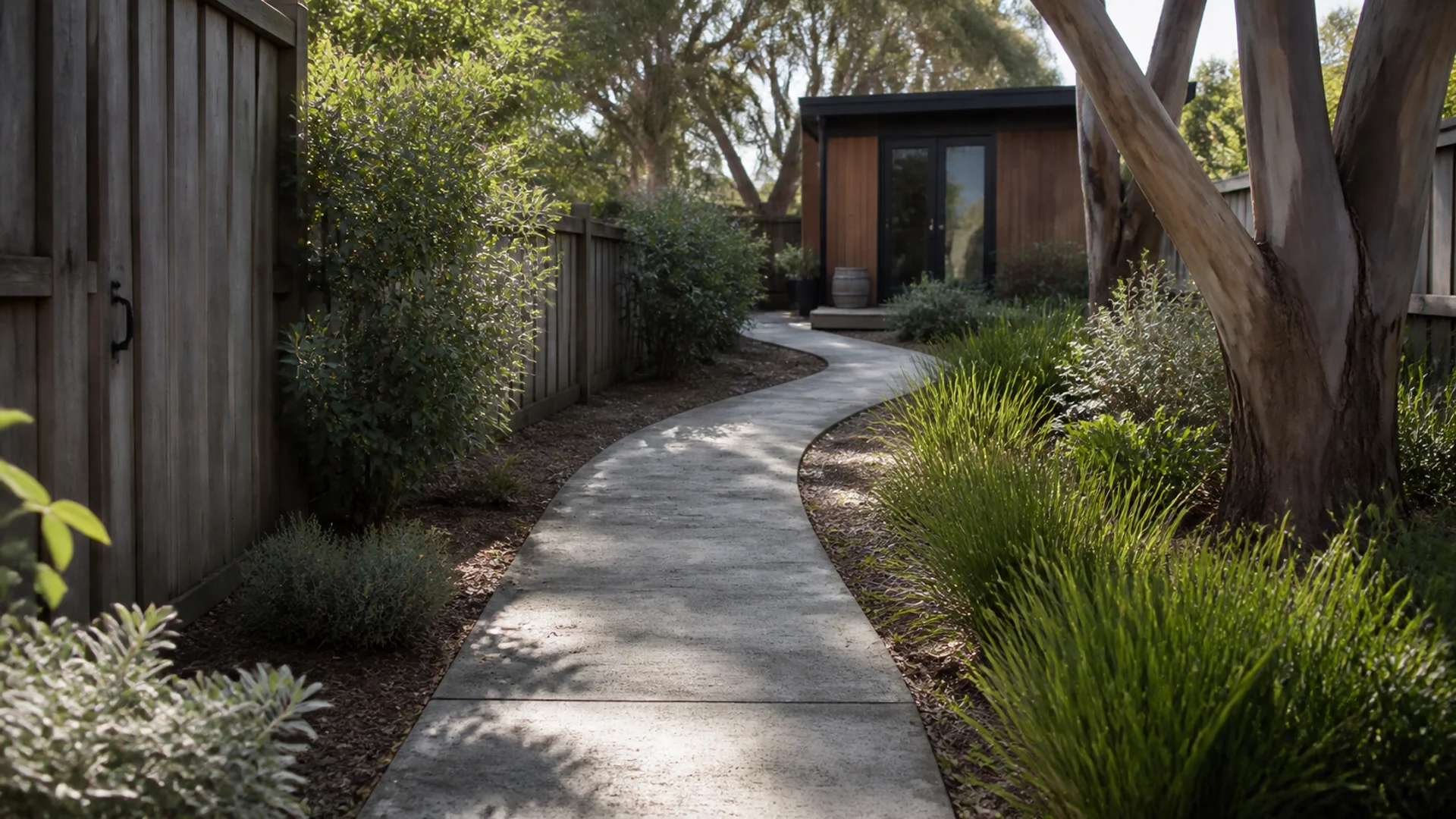 Concrete garden pathway beside a contemporary Australian house