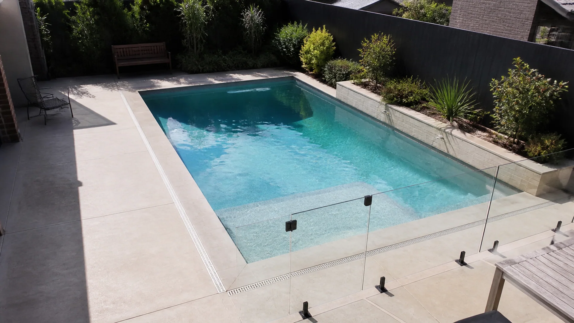 Textured concrete pool surround at an Australian backyard