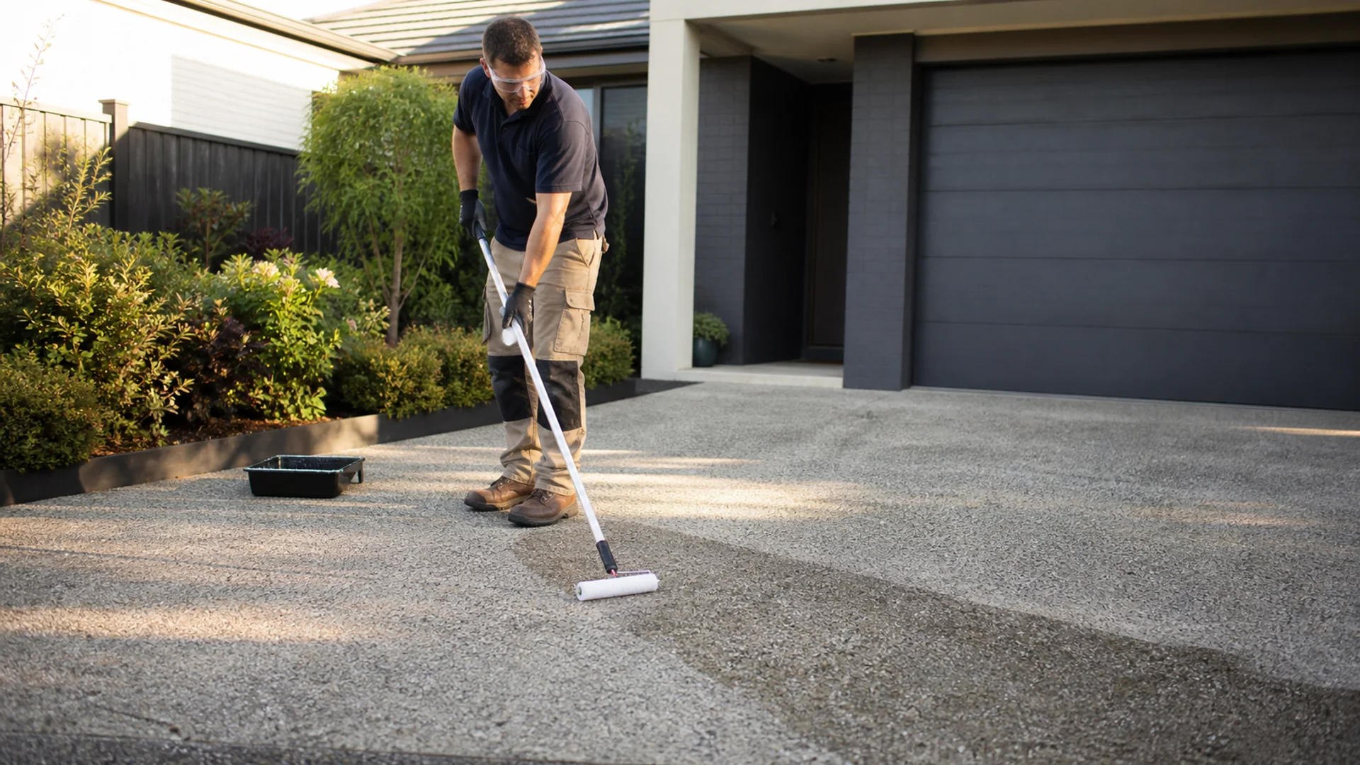 Protective sealer being applied to decorative concrete