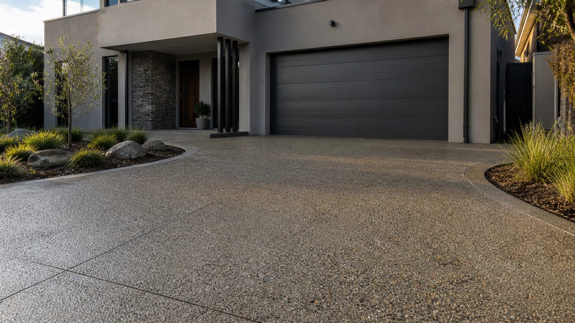 New exposed aggregate driveway beside a contemporary Australian home
