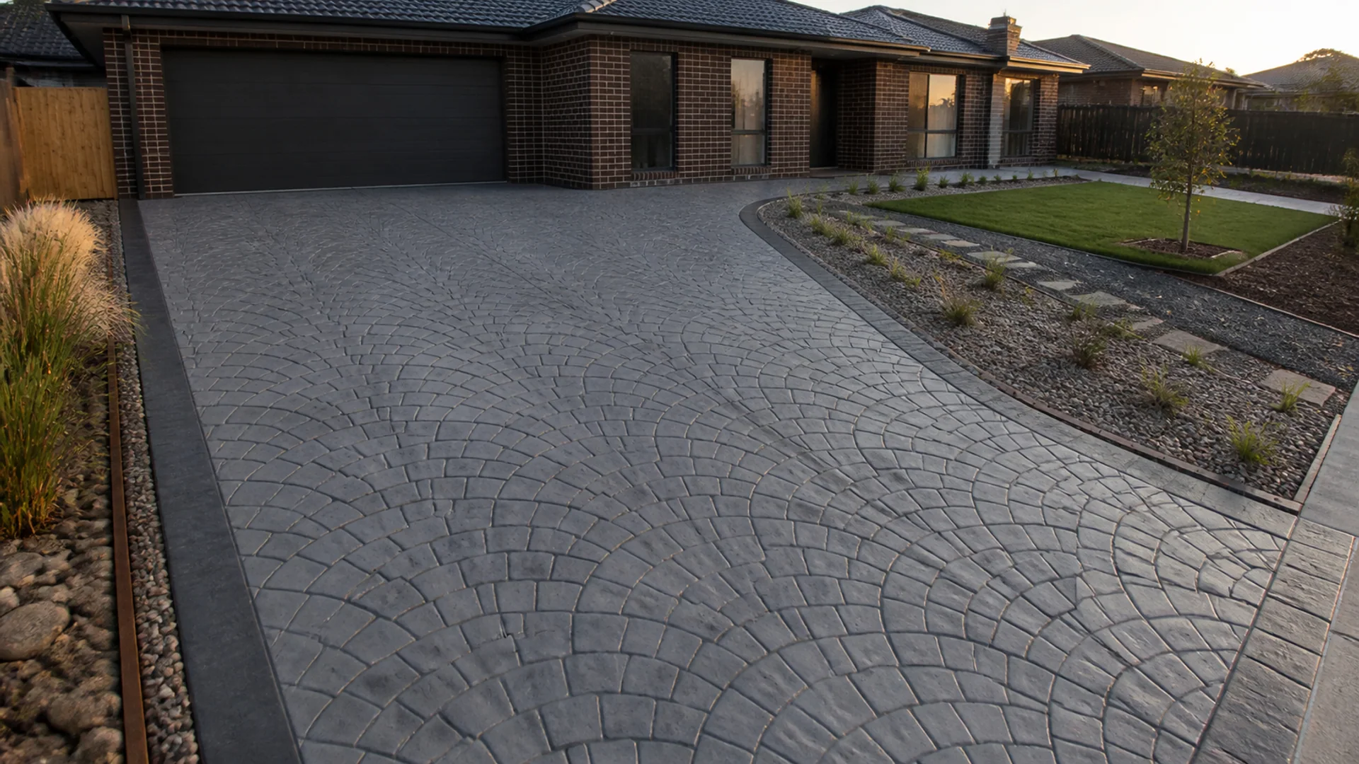 Stencil concrete driveway with a geometric border pattern